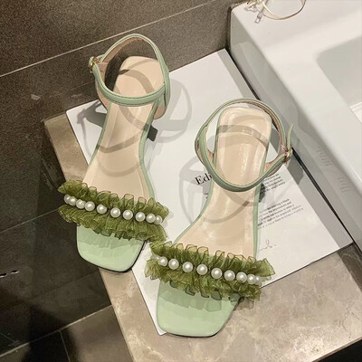 Sandals women 2019 new summer Korean version of one-word buckle with open-toed high heels thick with personality Pearl lace women
Sandals women 2019 new summer Korean version of one-word buckle with open-toed high heels thick with personality Pearl lace women