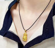 中國黃金（CHINA GOLD）黃金吊墜女足金觀(guān)音頭編織項鏈教師節實(shí)用生日禮物送女友男友愛(ài)人 火焰觀(guān)音 約5.8g【默認黑繩】 曬單實(shí)拍圖
