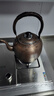 五福林 銅壺茶燒水壺復(fù)古純銅純紫銅加厚純手工大小茶壺茶具加湯壺電磁爐燃?xì)饷簹獯筇桒Q笛家用 活動把手5升錘紋鳴笛款【電磁爐明火通用】 曬單實拍圖