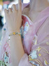中國(guó)黃金（CHINA GOLD）黃金手鏈女足金蓮花手鏈和田玉轉(zhuǎn)運(yùn)珠編織手繩七夕情人節(jié)生日禮物 足金蓮花手繩 約0.5g【品牌禮盒】 曬單實(shí)拍圖