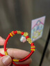 中國黃金福袋黃金手鏈寶寶款足金轉運紅繩嬰兒滿(mǎn)月周歲禮物送孩子兒童生日 足金大富翁手繩 曬單實(shí)拍圖