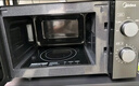 美的（Midea）快捷微波爐 家用小型 360°轉(zhuǎn)盤加熱 旋鈕操控 易潔內(nèi)膽（M1-L213B） 曬單實拍圖