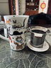 丹儂（DUNOON） 英國骨瓷茶杯 創(chuàng)意馬克杯帶蓋帶茶漏杯子情侶杯辦公室水杯泡茶杯 搗亂貓440ml 曬單實拍圖