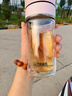 虎牌香港直郵虎牌（TIGER）茶水分離泡茶雙層防燙高檔玻璃杯商務水杯 粉紅色顯溫 300ml 曬單實拍圖
