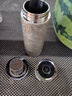 金力內(nèi)外純鈦保溫杯車載單手一鍵開(kāi)蓋茶水分離茶杯抑菌 雪花銀420ml 曬單實(shí)拍圖
