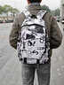 卡樂(lè )星男生電腦筆記本背包女初中生高中生書(shū)包超大容量大學(xué)生旅游雙肩包 小號黑白涂鴉+掛飾(適合3-6年級) 曬單實(shí)拍圖
