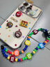 維妮恩趙露思同款彩色巧克力豆適用蘋(píng)果16promax手機殼新款15Pro帶掛繩支架14pro小眾17可愛(ài)女款全包防摔 電鍍大視窗【立體巧克力豆+M豆手鏈】 iPhone 14 Pro 曬單實(shí)拍圖