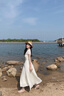 Mandy Zhang法式淡人系白色V領(lǐng)扭結短袖連衣裙女夏輕紗禮服長(cháng)裙子 香草米白 S 曬單實(shí)拍圖