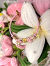 中國(guó)黃金（CHINA GOLD）桃花黃金手鏈女足金花朵轉(zhuǎn)運(yùn)珠手繩手串520情人節(jié)生日禮物送女友 【今/次日達(dá)】桃之夭夭手繩【粉繩】約0.3g 曬單實(shí)拍圖