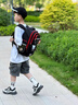 迪帥新款哪吒書(shū)包男生小學(xué)生一二三到六年級男兒童女孩護脊減負大容量 黑紅色+送掛飾+11件套 大號3-6年級 曬單實(shí)拍圖