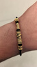 中國(guó)黃金（CHINA GOLD）黃金手鏈男女款足金饕餮彎管圖騰轉(zhuǎn)運(yùn)珠手繩情人節(jié)生日禮物送男友 【今/次日達(dá)】饕餮手繩【黑皮繩】約0.9g 曬單實(shí)拍圖