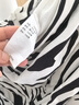 艾諾絲雅詩(shī)【商場(chǎng)同款】夏新款斑馬紋抽褶包臀荷葉邊短裙半身裙10423501 黑白色 S 曬單實(shí)拍圖