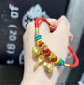 中國(guó)黃金（CHINA GOLD）寶寶黃金手鏈足金吉祥三寶錦衣玉食紅手繩飾品嬰兒童周歲滿(mǎn)月禮物 今/次日達(dá)-吉祥三寶手鏈 約0.8g 曬單實(shí)拍圖