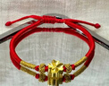 中國(guó)黃金（CHINA GOLD）黃金四葉草手鏈女款足金幸運(yùn)草轉(zhuǎn)運(yùn)珠手飾節(jié)日生日禮物送女友老婆 四葉草手鏈紅繩約0.2g【國(guó)金禮盒】 曬單實(shí)拍圖