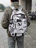 卡樂(lè )星男生電腦筆記本背包女初中生高中生書(shū)包超大容量大學(xué)生旅游雙肩包 小號黑白涂鴉+掛飾(適合3-6年級) 曬單實(shí)拍圖