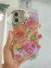 圣圖朗新款扭扭邊藍粉花朵適用iPhone17蘋(píng)果15手機殼16PromAX閃粉鏡頭14plus高級支架12復古輕奢13防摔套 扭扭邊-粉底大牡丹-鏡頭支架 iPhone 12 曬單實(shí)拍圖