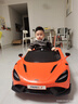 攜手邁凱倫兒童電動(dòng)車(chē)四輪寶寶汽車(chē)可坐人男女小孩遙控玩具跑車(chē)兒童車(chē) 至尊橙全功能+大鋰電續航5小時(shí) 曬單實(shí)拍圖