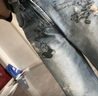 UR2025秋季新款女裝潮流涂鴉破洞磨破彎刀牛仔長(cháng)褲UYV850150 曬單實(shí)拍圖