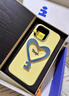 Tagi.《讓人開(kāi)心》金屬支架皮質(zhì)愛(ài)心手機殼全包防磨蘋(píng)果手機殼適用iphone16pro節日禮物-開(kāi)心黃油 曬單實(shí)拍圖