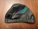 李寧（LI-NING） 泳帽男士PU涂層游泳帽女舒適貼合護發(fā)護耳時(shí)尚印花成人游泳裝備 黑色 曬單實(shí)拍圖