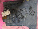 UR2025秋季新款女裝潮流涂鴉破洞磨破彎刀牛仔長(cháng)褲UYV850150 曬單實(shí)拍圖