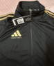 阿迪達斯（adidas）外套男女秋冬跑步運動(dòng)立領(lǐng)夾克外套保暖運動(dòng)服 黑/金 L 曬單實(shí)拍圖