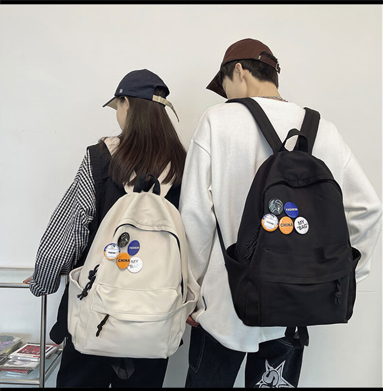 木丁丁 书包双肩包韩版小学生初中生背包休闲韩版尼龙勋章背包 黑色