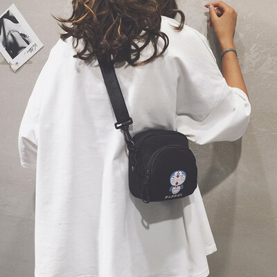 

Cartoon small bag female 2019 new wave Korean fashion wild print girl canvas student shoulder Messenger bag