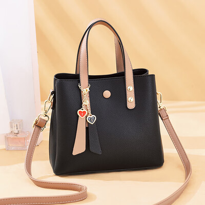 

Handbag lady simple large capacity collision color single shoulder huddle inclined pack foreign temperament Korean version tide