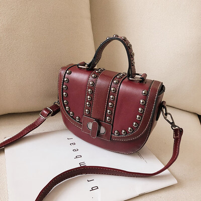

Qiao Bani 2019 new South Korea ins retro style fashion rivet saddle bag shoulder shoulder diagonal tide handbag