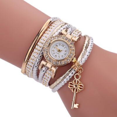 

Creative fashion ladies winding bracelet watch gold key pendant quartz watch female models explosion models