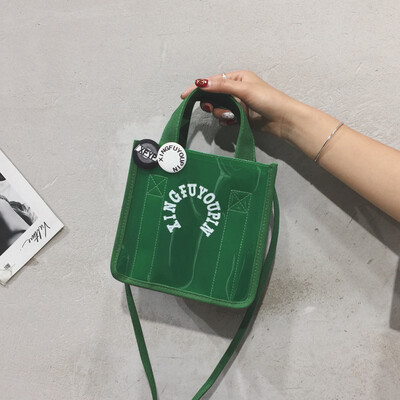 

Portable transparent bag canvas bag handbags new 2019 students Korean version of the slung Japanese girls cute shoulder bag tide