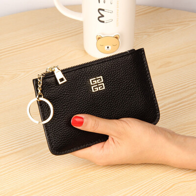 

The first layer of cowhide Europe&the United States big ladies leather short paragraph purse zipper mini lychee with ring key bag