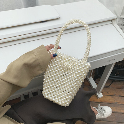 

Qiao Bani 2019 new Korean Bohemian fashion handmade pearls hand strap shoulder diagonal trend handbags