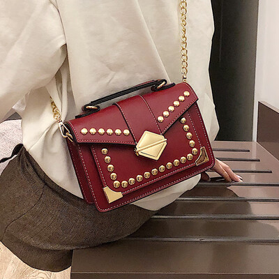 

Bag female 2019 new Hong Kong style wild casual retro rivet fashion lock wide shoulder strap shoulder Messenger bag
