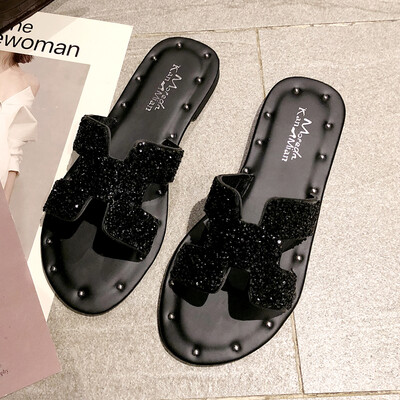 

Korean version wearing h slippers outside spring fashion water drill ins harbor wind flat bottom one-word sandy beach slipper