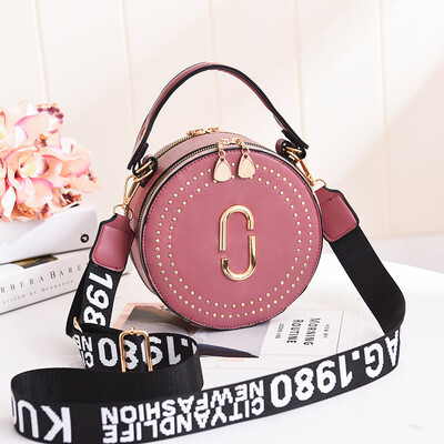 

Fashion rivet small round bag portable Korean version of the lady bag shoulder diagonal wide shoulder strap small bag