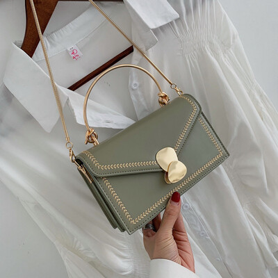 

Qiao Bani 2019 new Korean chic fashion embroidery thread chain flip hard handle handbag shoulder diagonal handbag