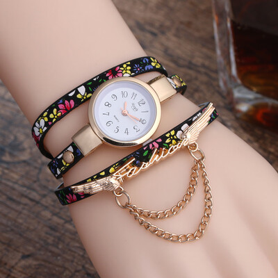 

New broken pattern ladies winding fine strap watch female models fashion wings pendant quartz watch