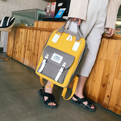 

Large-capacity school bag female 2019 new Korean version of the fashion contrast color casual canvas bag wild campus backpack