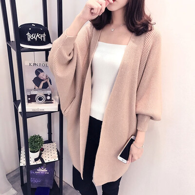 

The 2018 autumnwinter new medium&long knitted cardigan womens thick sweater overcoat is draped over the womens dress