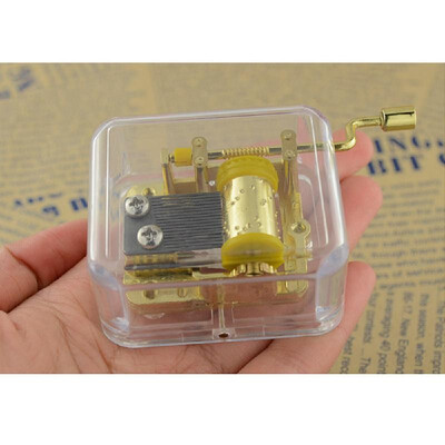 

Unique Musical Box Acrylic Hand Crank Music Box Golden Movement Melody