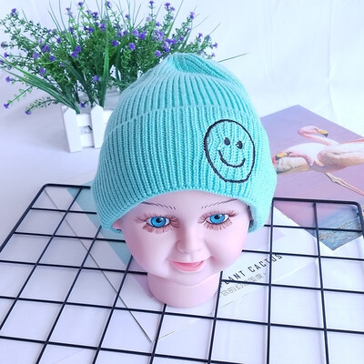 

Childrens wool hats Korea autumn&winter new warm smiling face knit cap head cap boys&girls baby hat candy