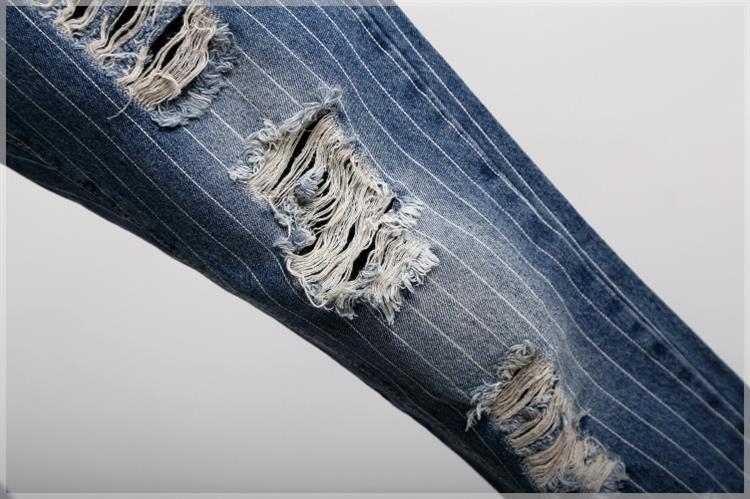 红唇印2015秋款欧洲站新品韩版破洞女式牛仔裤 卷边破洞补丁跨裤可