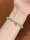 The bracelet is beautiful, the sisters are so white, the color is light green and crystal clear, I like it very much.