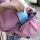 The bag has a large capacity and can be used on both shoulders and hand. The color is very fresh and pink and very beautiful. It can also be waterproof and carry it on the body without getting too hot. There is also a lot of space inside the bag. It can hold computers, umbrellas, skin care products, There are four or five pieces of clothing, and shoes can be tucked in from the bottom opening, which is very suitable for fitness and short trips