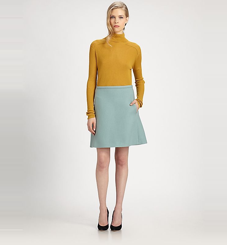 this close-fitting, finely ribbed pullover is knit from a sot