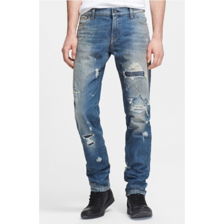 holey, distressed abrasions inset with contrasting denim fabric