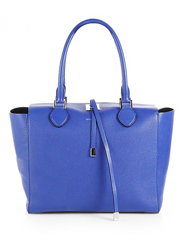 available in luggage and pink with goldtone hardware or royal