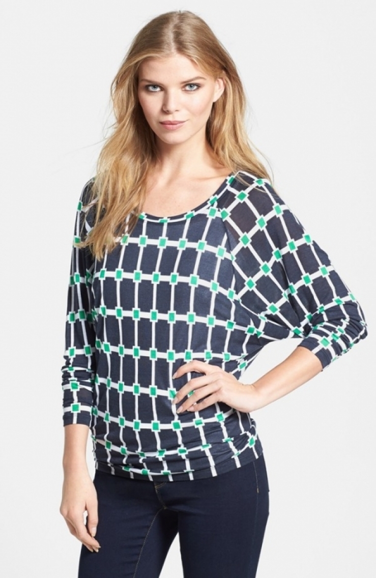 with bright green defines a stretchy, scoop-neck top fashioned